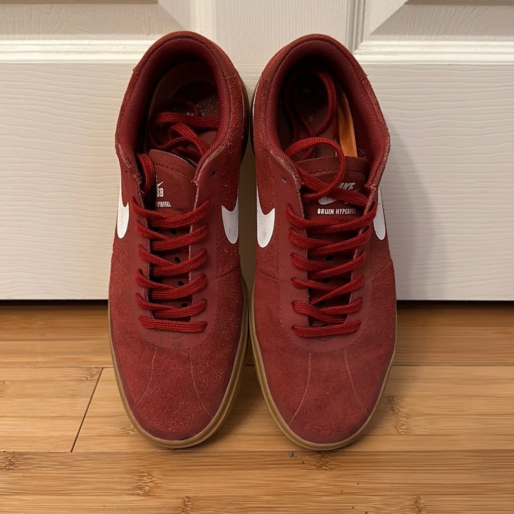 Red suede Nike sneakers